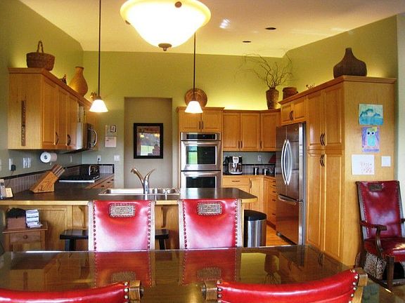 The eating area is open to the kitchen and the family room. All of the areas look out to the beautif