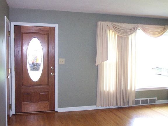 Update front door, with coat closet just inside the Living Room.  New living room window in 2007.