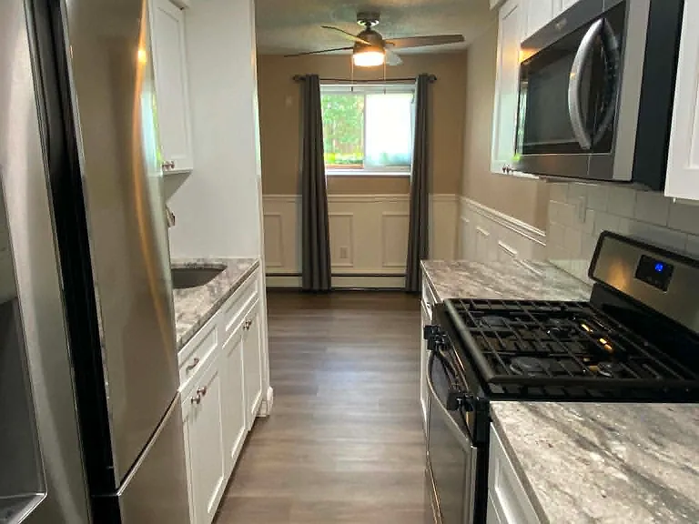 Updated kitchen leading to dining area