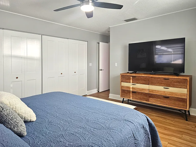 Spacious Master Bedroom with a King Bed, 60" Smart TV and Large Closets