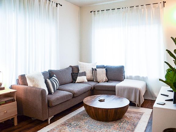 Living Room with plank flooring or similar