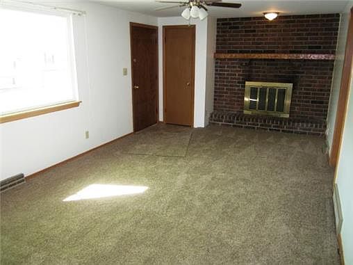 LIVING ROOM W/ MASONRY FIREPLACE