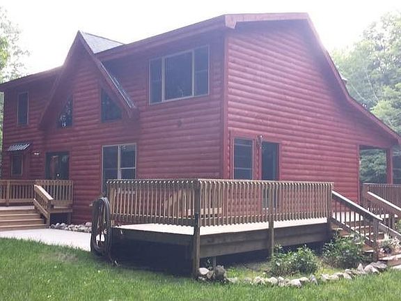 Back of home with deck