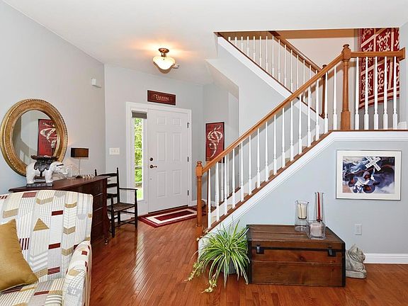 Picture of foyer with open staircase leading to finished lower level and to the second floor