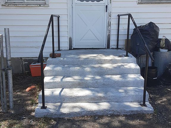 Steps going into back door.