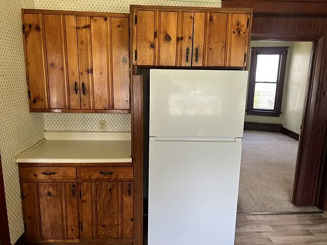 Kitchen view with new refrigerator.