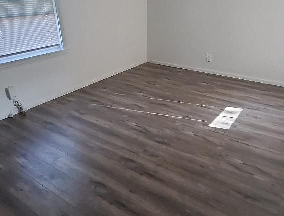 Great size master, with nice closet, laminate flooring and ceiling fan.... overlooking the serene backyard