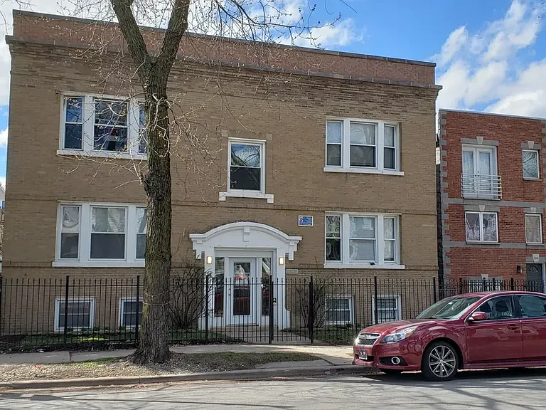 3112 N. Kimball, top floor on the left.