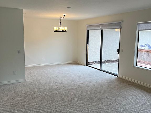 Dining area adjacent to patio with view of greenbelt