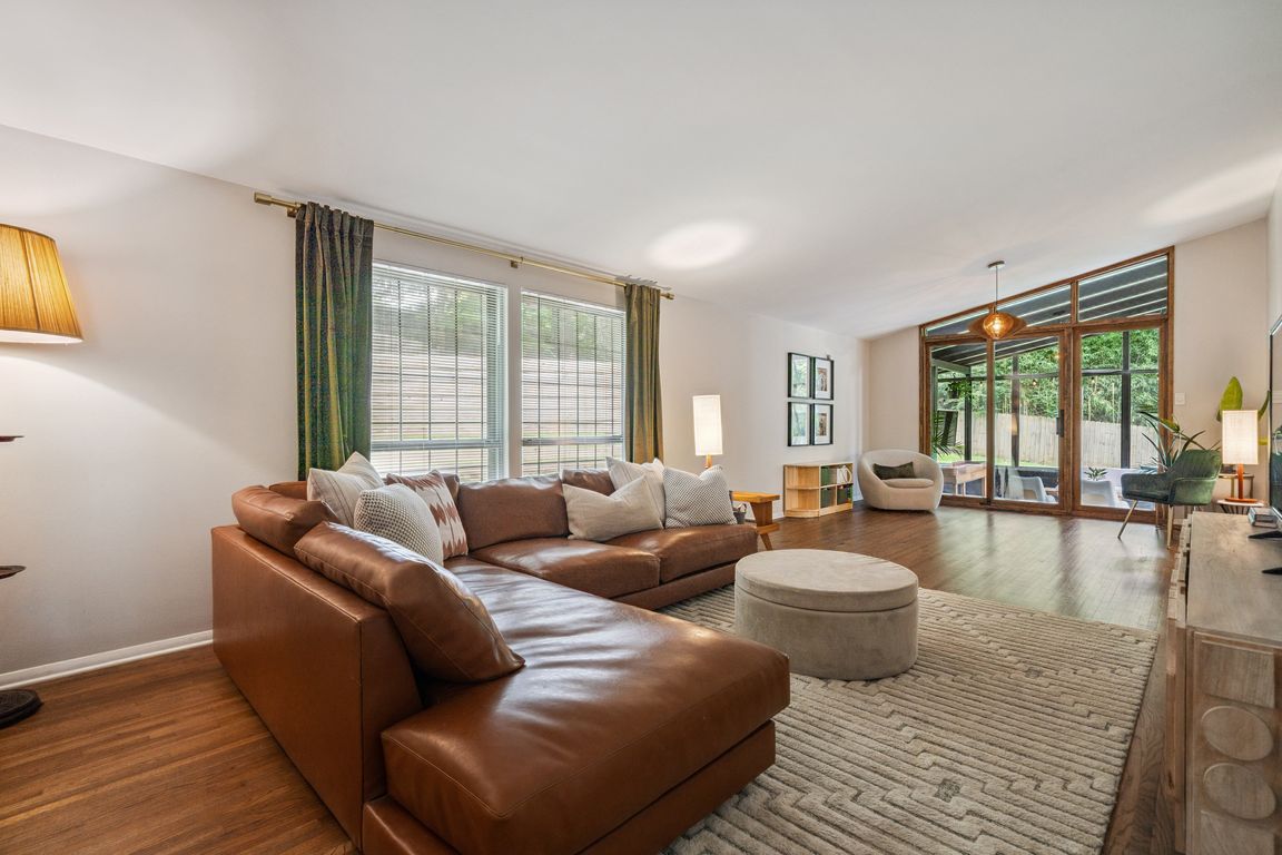 04-Massive living room with custom door to screened porch
