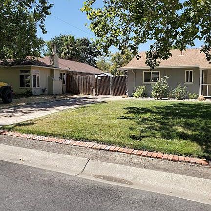 Front of House with extra driveway