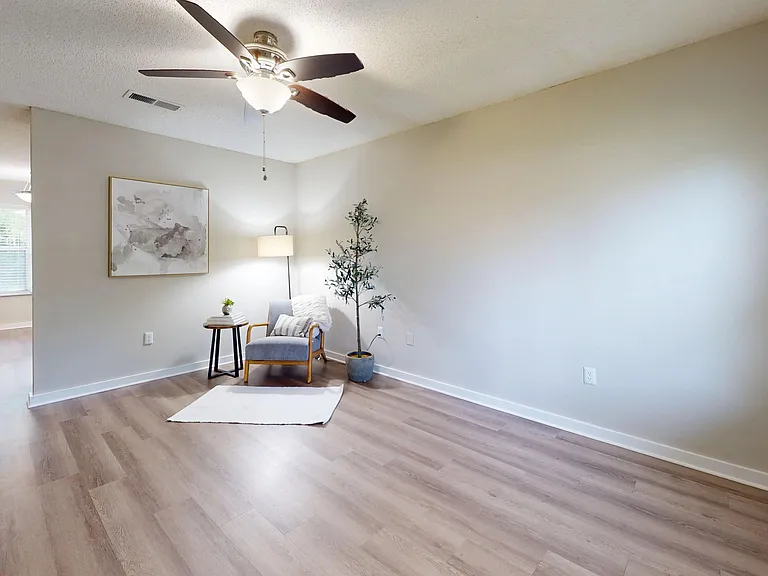 Illuminate your days in our sun-drenched apartment, where elegant wood floors seamlessly guide you from the inviting entry to the heart of the homethe vibrant and stylish kitchen.
