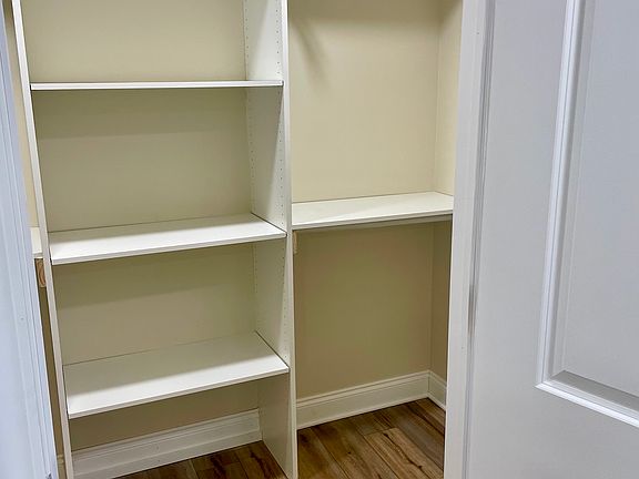 Walk in closet with built in shelves
