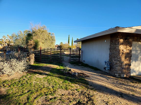 Custom made fence and gate separating front yard from back yard.