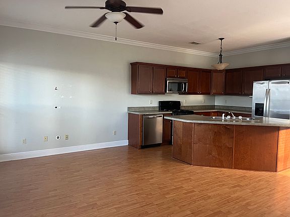 Living and kitchen area off the front door.
