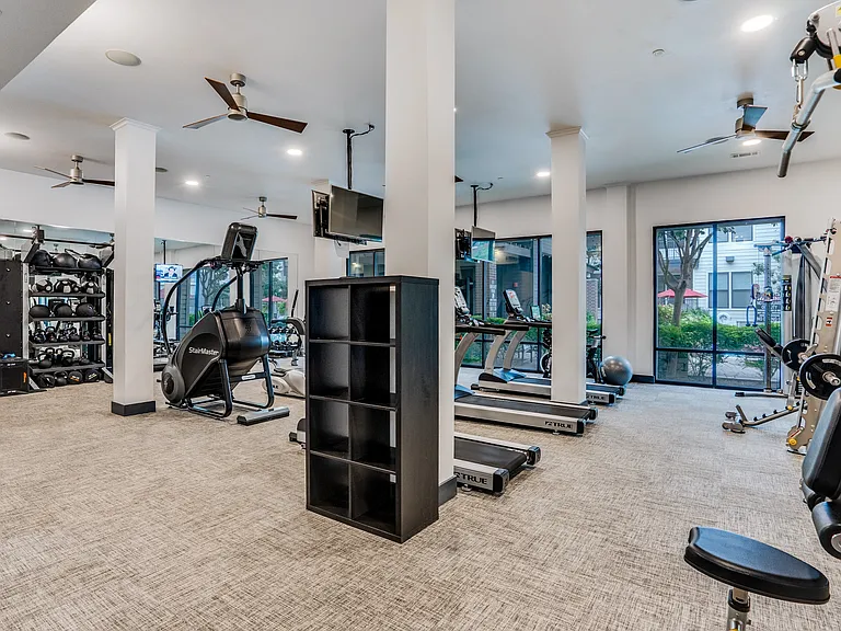 fitness center with cardio and weight equipment