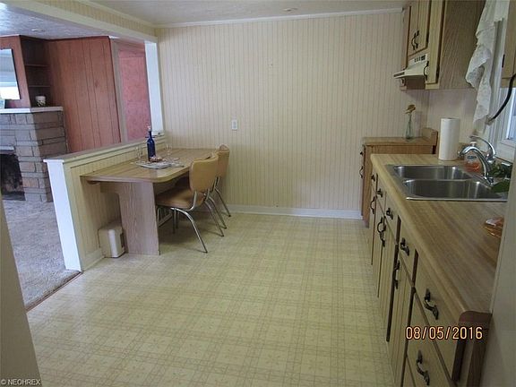 Kitchen offers breakfast bar style seating.