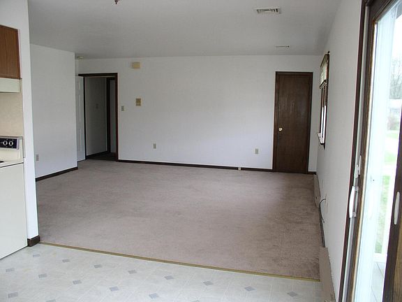 Looking at the Living room ( 15'X15' ) from the kitchen. Main entry door is on left in corner and a small coat closet in right corner