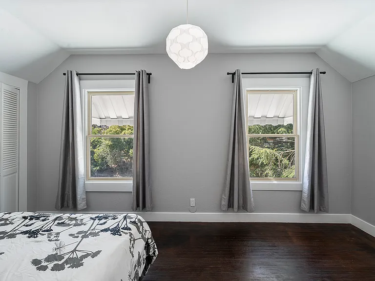 Master bedroom bedroom with dual walk in closets.