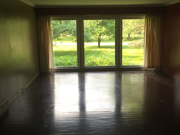 Family room has windows floor to ceiling the length of room