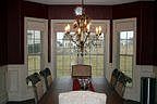 Dining room with custom light, tray ceiling & crown molding
