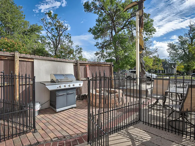 Outdoor seating and barbeque seating area, shared with other guests and tenants.