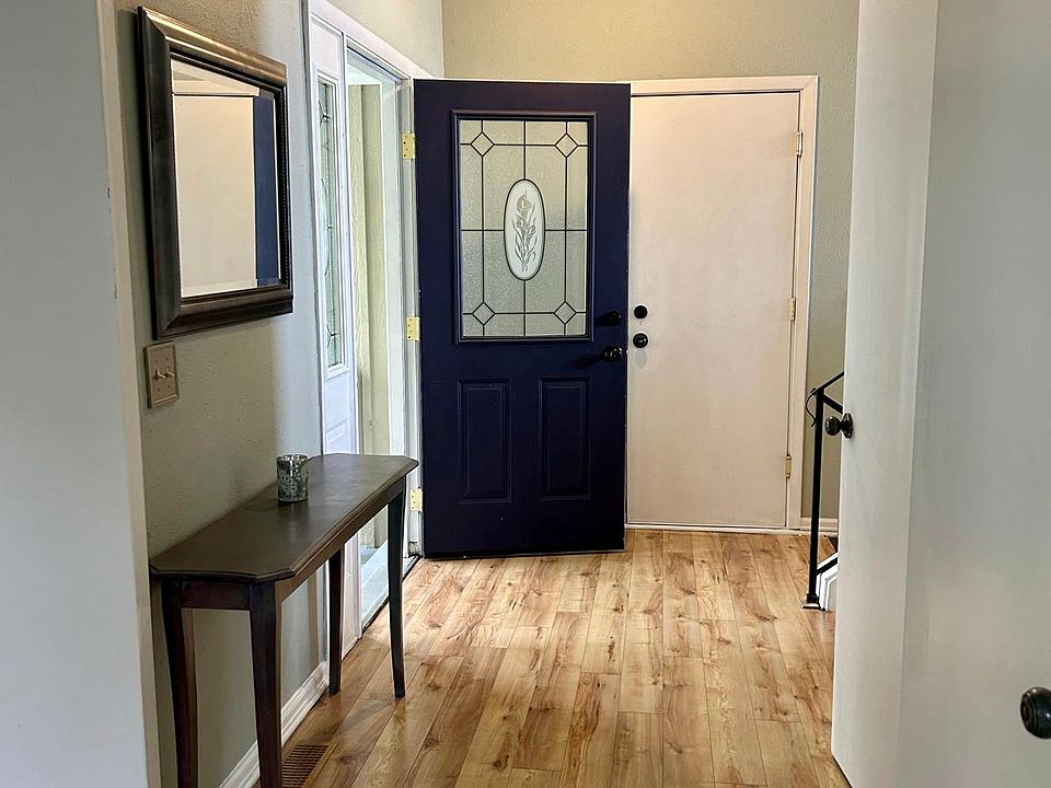 entrance room with closet and door to one-car garage