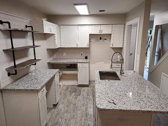 LARGE! kitchen - Island, custom shelves! Cool faucet!