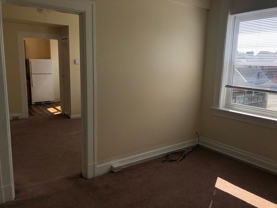living room, dining room to left and then kitchen. Bedroom to right