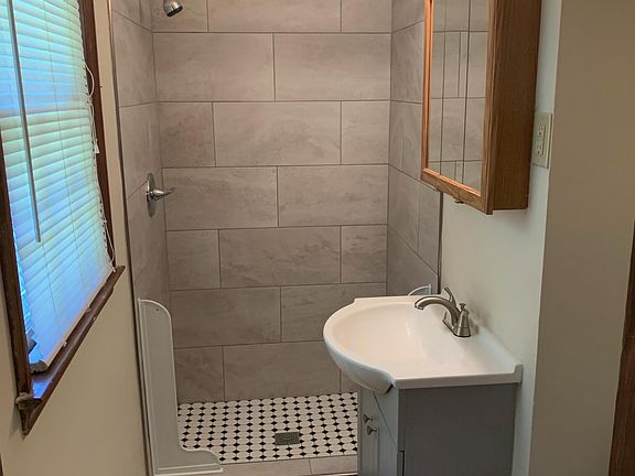 Remodeled bathrooms with new tile floors, shower & vanity!