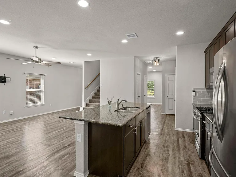VIEW OF LIVING AREA FROM BREAKFAST NOOK. TO YOUR RIGHT IS THE MASTER BEDROOM