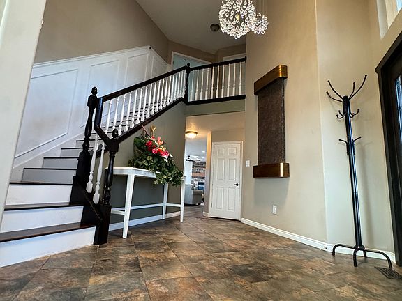 Entryway with wall fountain and Chandelier