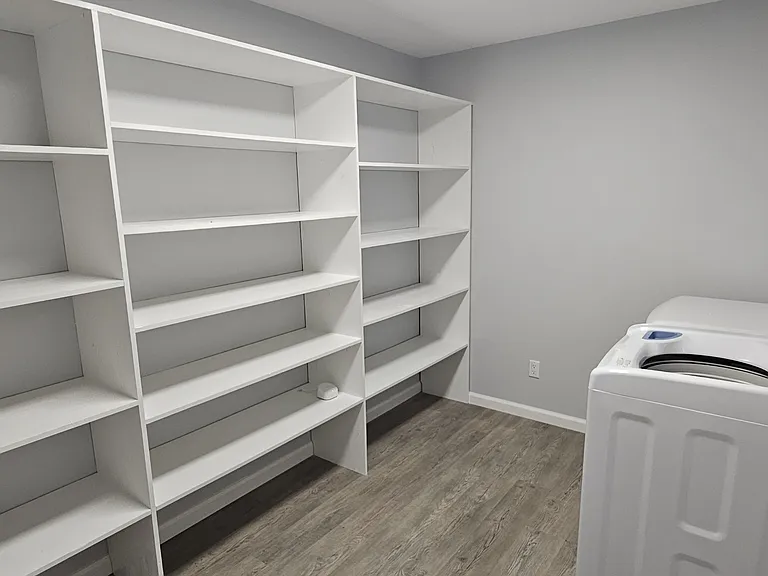 Pantry off of kitchen - washer and dryer - with plenty of shelves