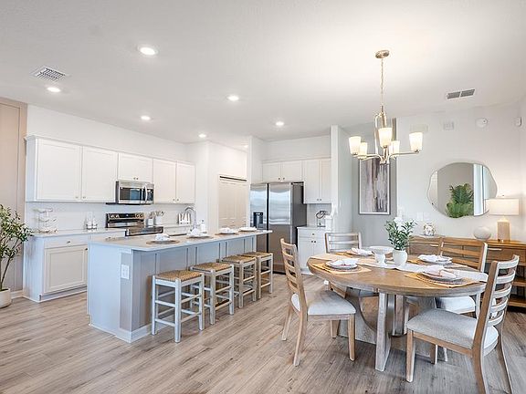 Your bright, open kitchen includes quartz counters, 42-inch cabinets, and Samsung SS appliances - Ph