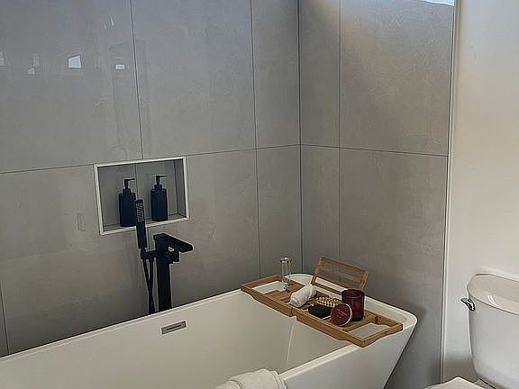 Standing tub with shower.