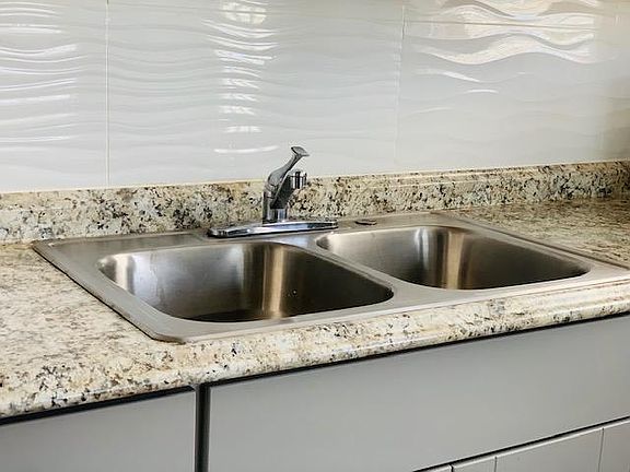 Kitchen Sink, Countertop, and Backsplash Closeup