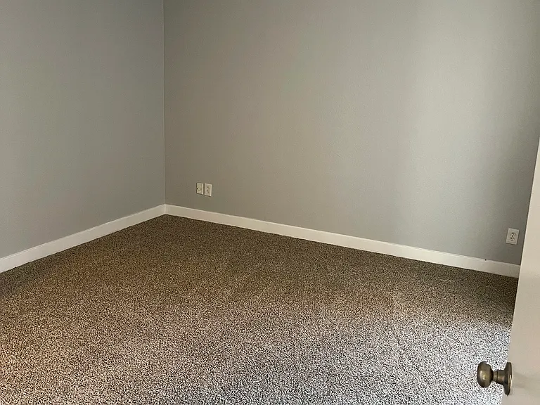 bedroom with sliding glass door and walk in closet