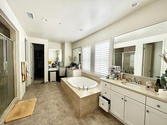 Master Bathroom; Vanity table; His and Hers walk-in closets and sinks