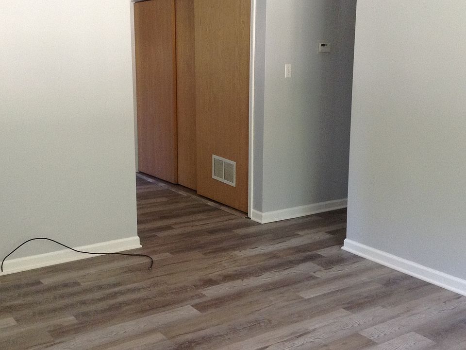 Washer/Dryer, Furnace, Hot Water Heater behind sliding doors in kitchen. Hall way to bed rooms and bath.