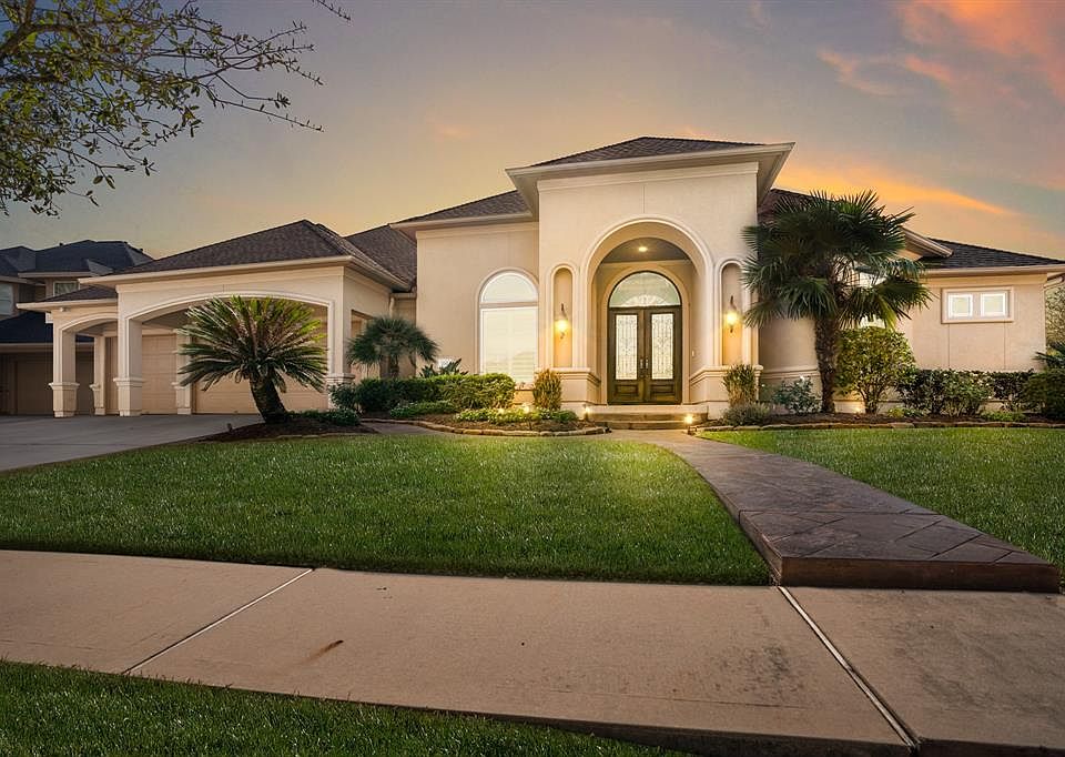 Welcome to 7011 South Cross Lane, nestled in a secluded gated Estates section of Windrose on large corner lot, within walking distance to Eagle Lake as well as the community pool area at the front gates to the neighborhood.