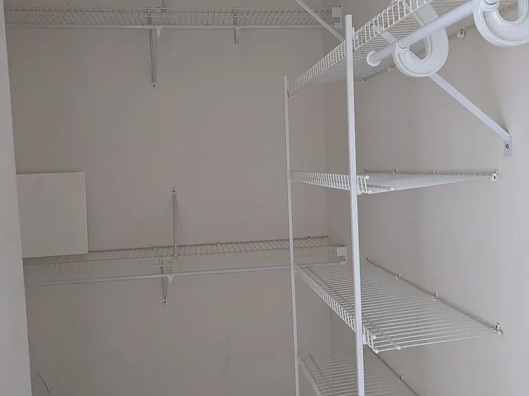 Primary Bedroom walk-in closet.