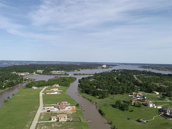 Image 3: Estate homes all around you RIGHT on Lake Conroe, and away from the hustle and bustle of it, but still close enough to 