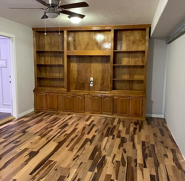 Family Den with wood flooring.