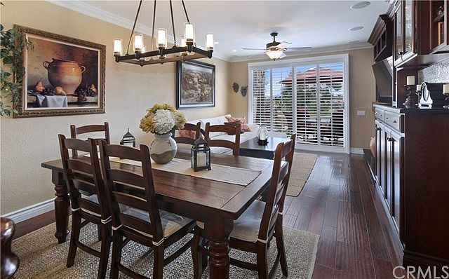 So much to love! Hardwood floors, custom built-in cabinets, crown and base molding, plantation shutt