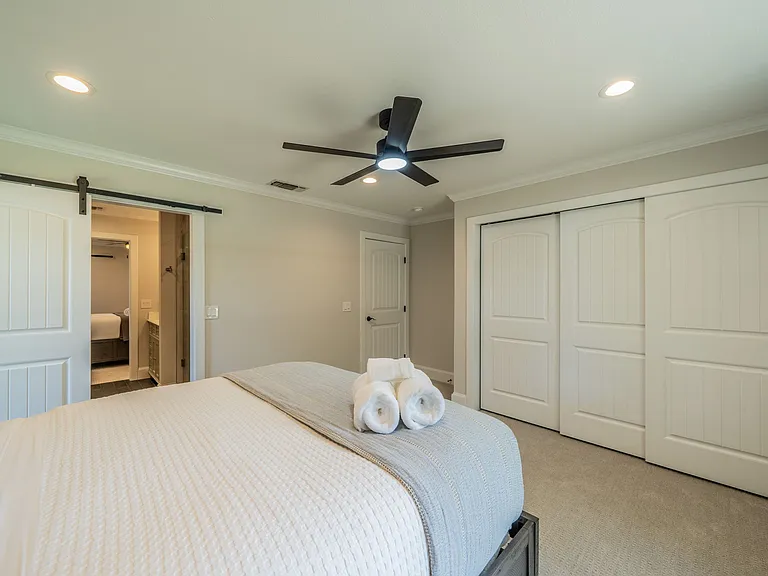 Bright Bedroom 3 with Stylish Barn Door and Ample Storage Space