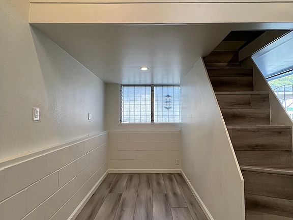 main living area that fits up to a queen mattress. Loft storage.