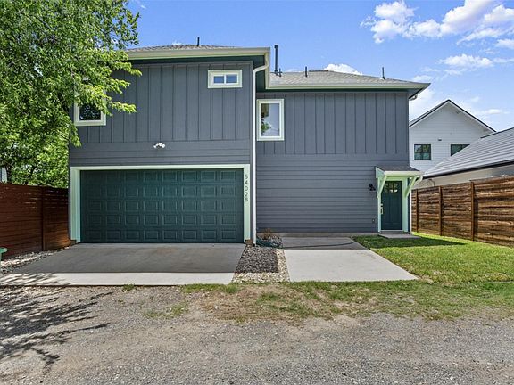 Front entrance of home. Two door garage where w/d is located.