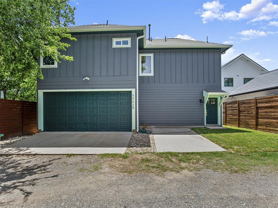 Front entrance of home. Two door garage where w/d is located.