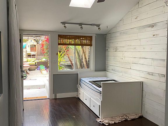 Standing by the hall looking out