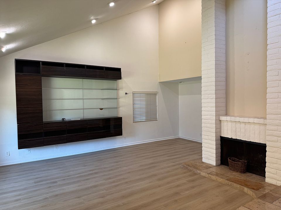 Living room with fireplace and entertainment center